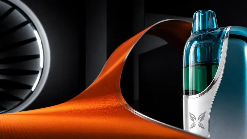 Close-up of a WINDBAR CHROMA WING in Ice Cyan with an orange ribbon and turbine (WindBar.ai)