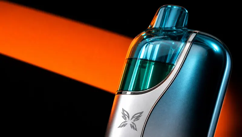 Macro of the tinted cap and brushed silver shell on a WINDBAR CHROMA WING in Ice Cyan (WindBar.ai)