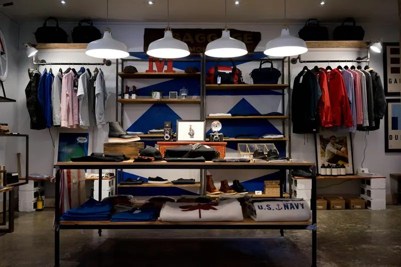 Clothes hanging on a retail rack (Unsplash stock) — WindBar.ai D91 Voyagers