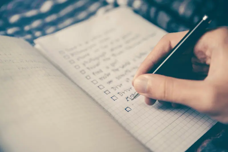 Checklist on notebook with pen (Unsplash stock) — WindBar.ai D91 Voyagers Source: Photo by Glenn Carstens-Peters on Unsplash (Unsplash License). Not a WindBar product photo.