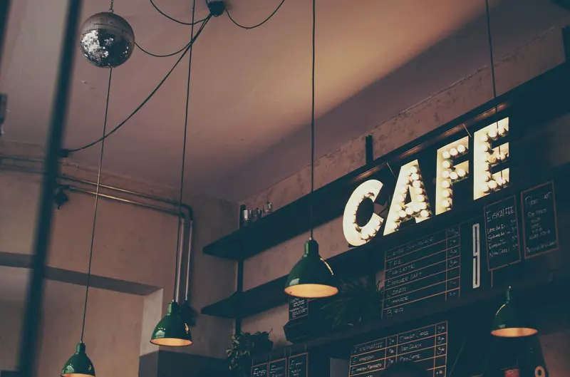 Cozy coffee shop interior (Unsplash stock) — WindBar.ai D91 Voyagers