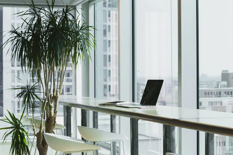 Modern office desk with monitors (Unsplash stock) — WindBar.ai D91 Voyagers