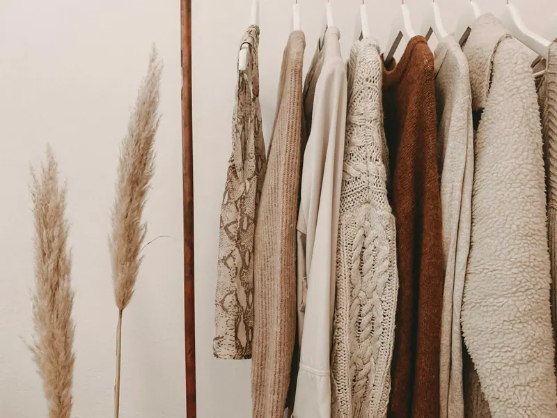 Clothing racks under boutique lights (Unsplash stock) — WindBar.ai D91 Voyagers