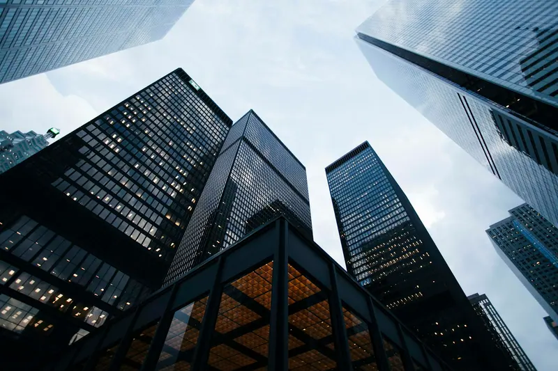 Glass skyscraper reflections (Unsplash stock) — WindBar.ai D91 Voyagers