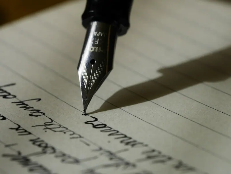 Open notebook with pen (Unsplash stock) — WindBar.ai D91 Voyagers