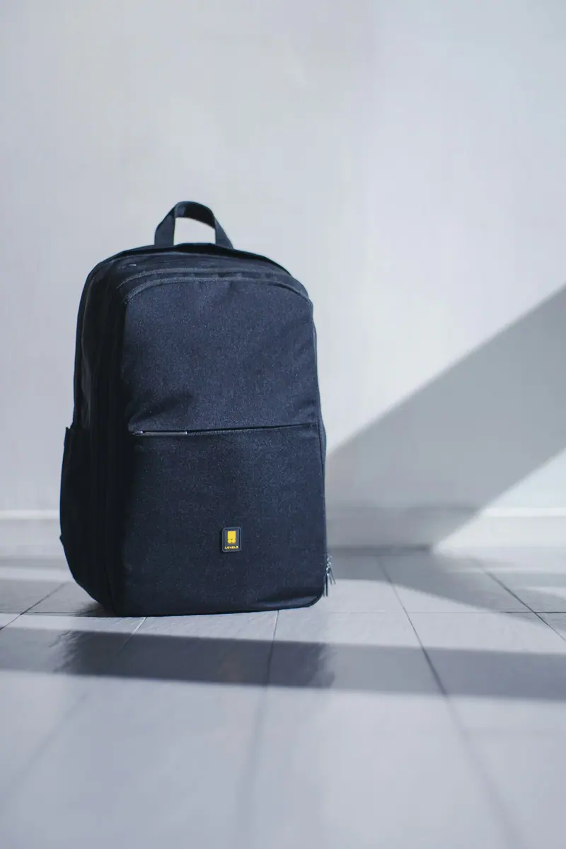 Leather bag carry cue (Unsplash stock) — WindBar.ai D91 Voyagers