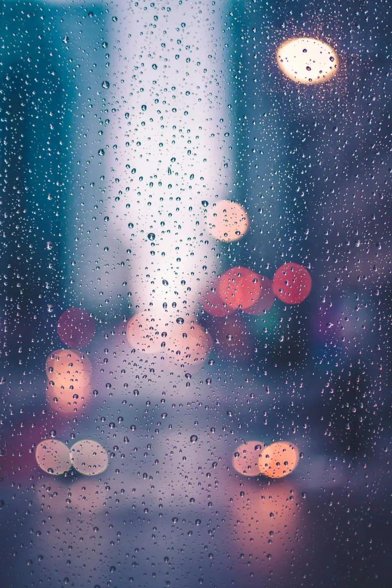 Raindrops on a window pane (Unsplash stock) — WindBar.ai D91 Voyagers