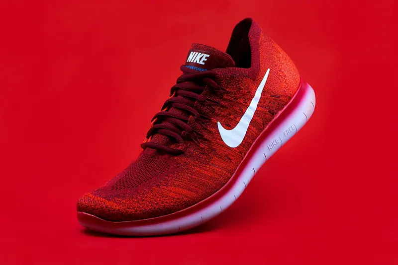 Red sneakers product photo (Unsplash stock) — WindBar.ai D91 Voyagers