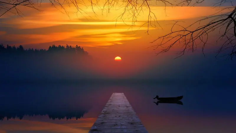 Warm orange sunset sky (Unsplash stock) — WindBar.ai D91 Voyagers